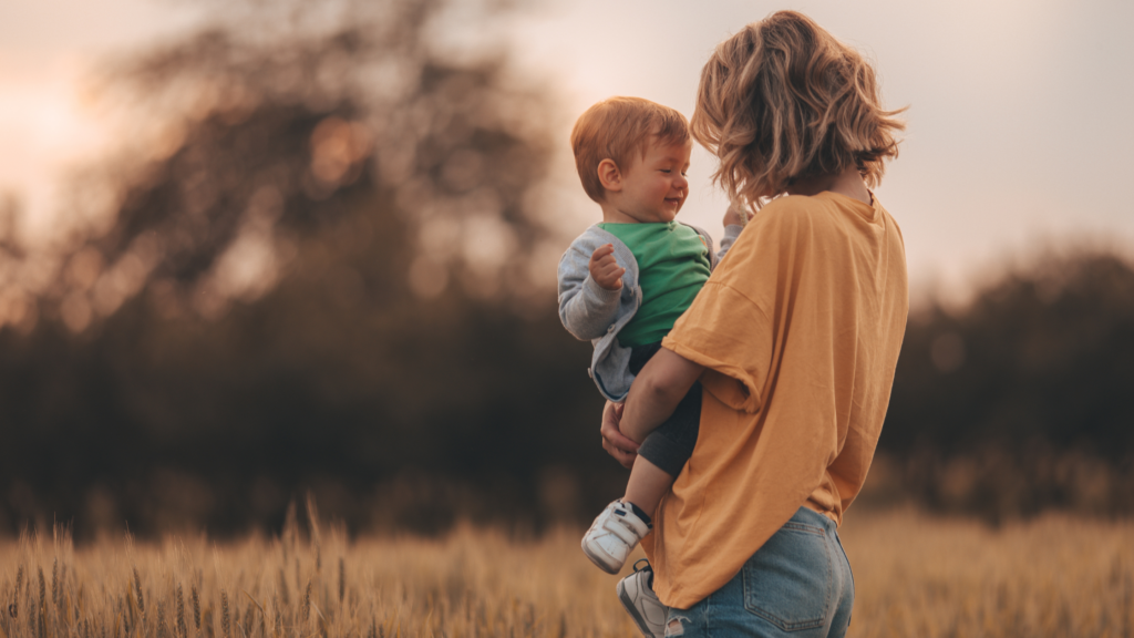 attachment therapy and coaching, woman holding child, attachment in motherhood